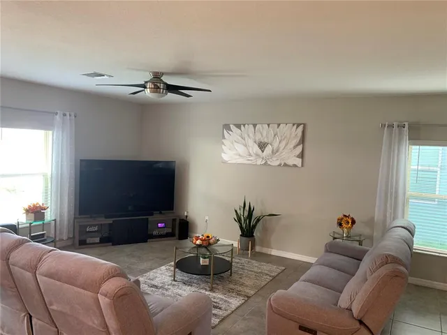 a kitchen with a sink a stove and wooden cabinets