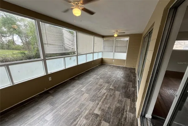 a view of an empty room with a window