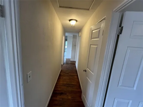 a view of a hallway with a glass door