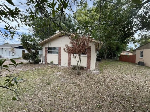 a house with a tree in the background