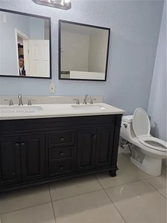 a view of a livingroom with an empty space and a window