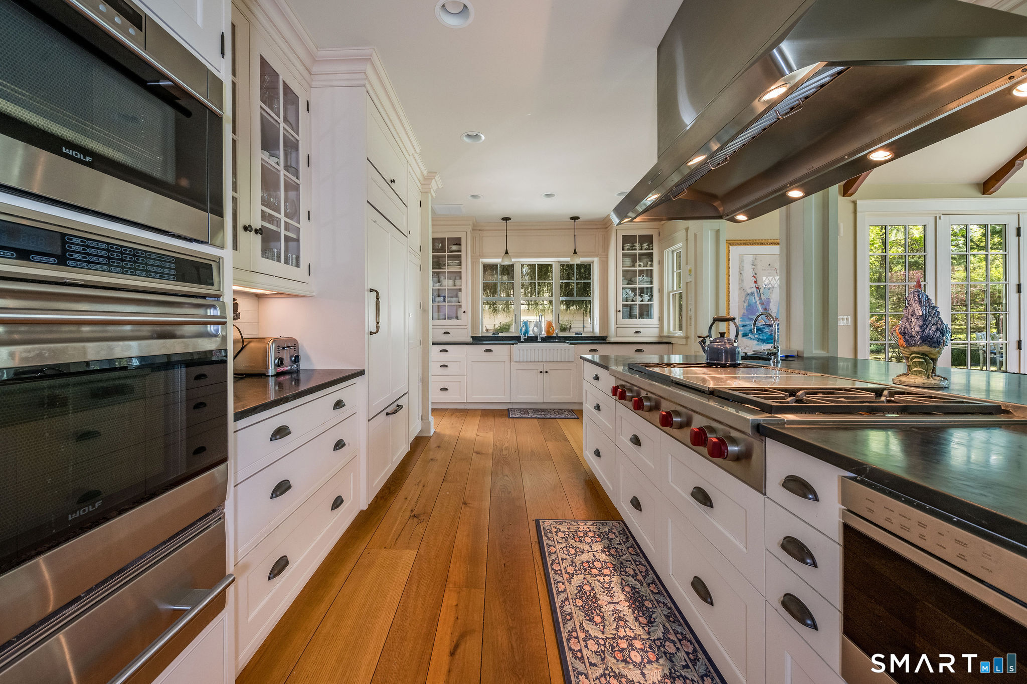 880 Boston Post Road Madison, CT 06443 - Photo 20 of 40 a large kitchen with stainless steel appliances granite countertop a stove and a sink