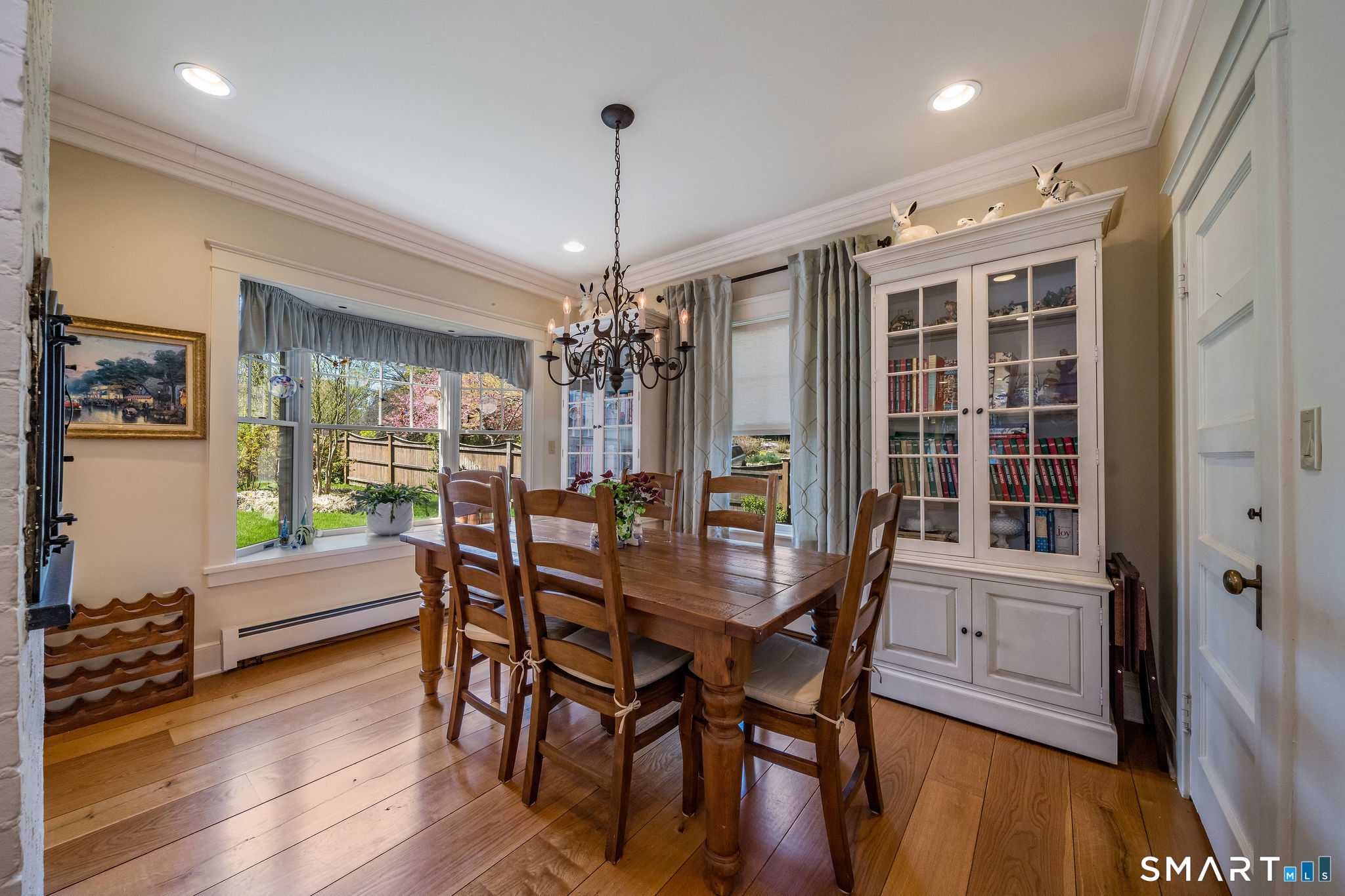 880 Boston Post Road Madison, CT 06443 - Photo 23 of 40 a dining room with furniture window wooden floor
