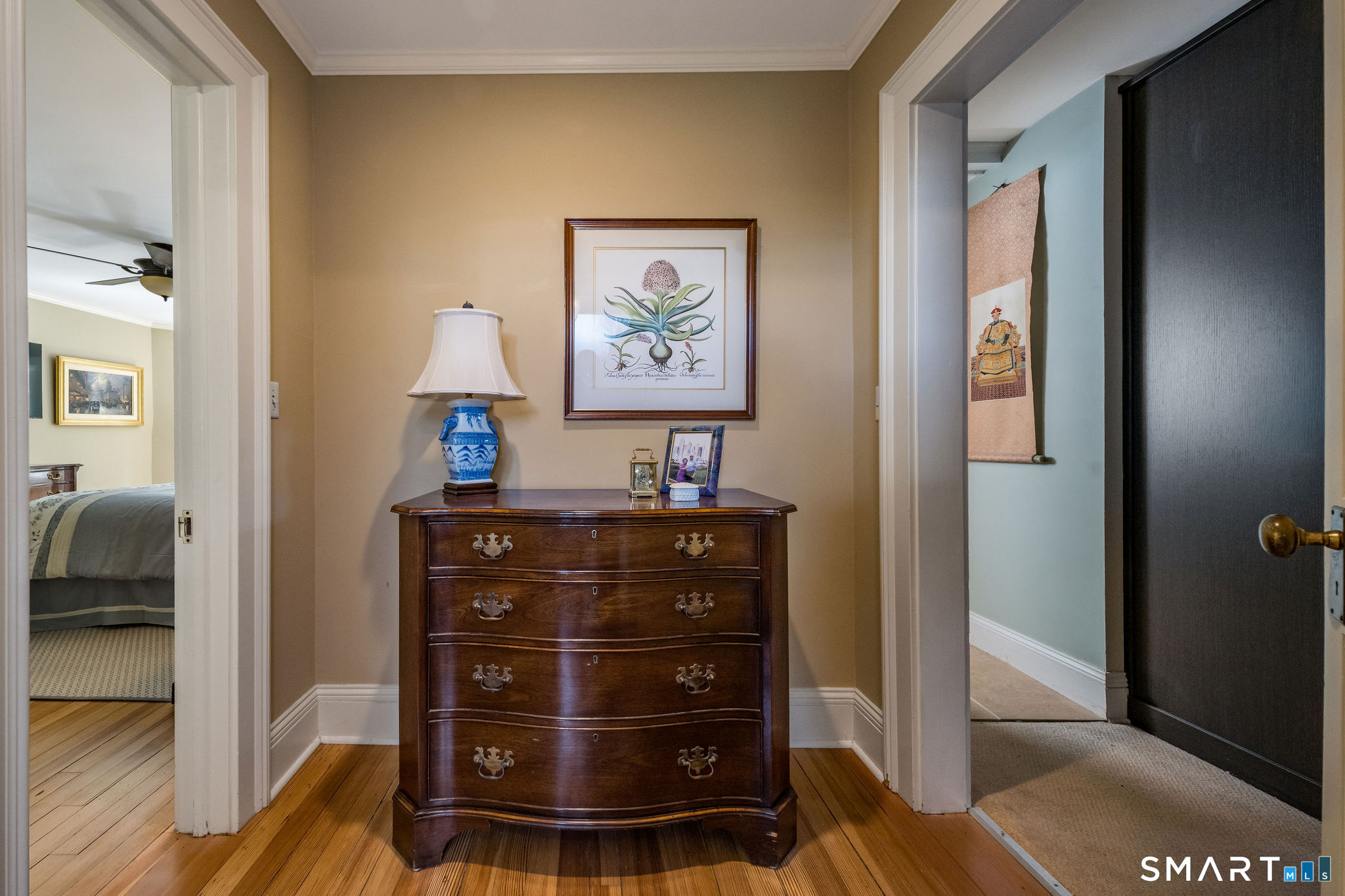 880 Boston Post Road Madison, CT 06443 - Photo 27 of 40 a view of a hallway with closet and a couch
