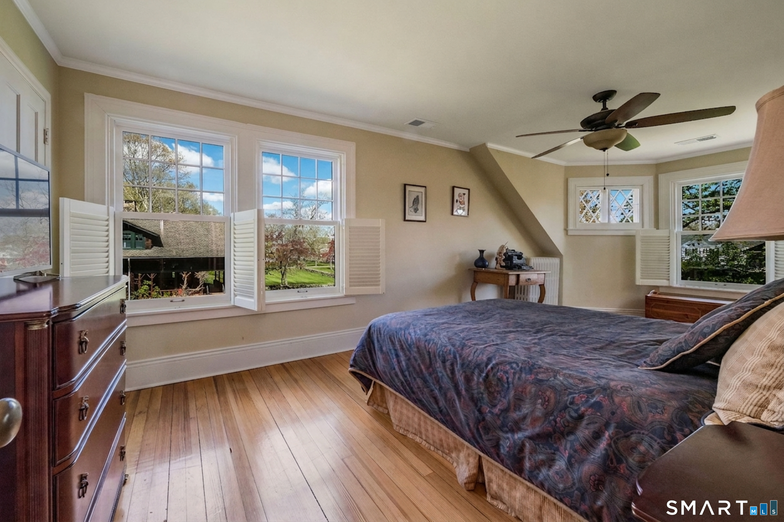 880 Boston Post Road Madison, CT 06443 - Photo 36 of 40 a bed room with a bed and a large window