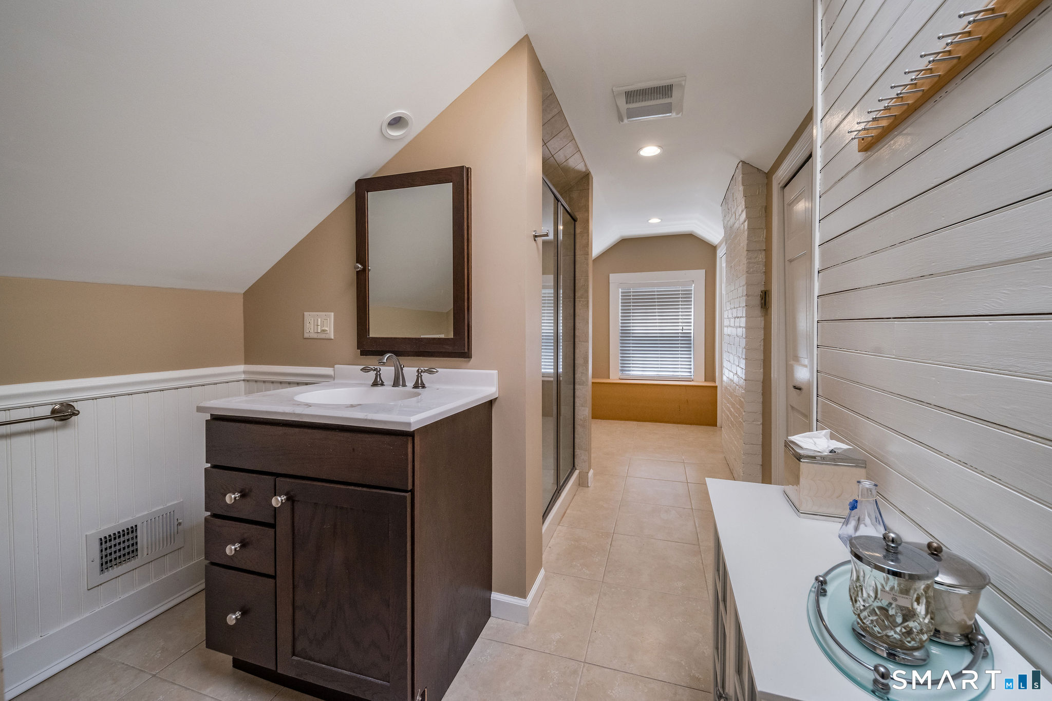 880 Boston Post Road Madison, CT 06443 - Photo 40 of 40 a bathroom with a sink and a mirror