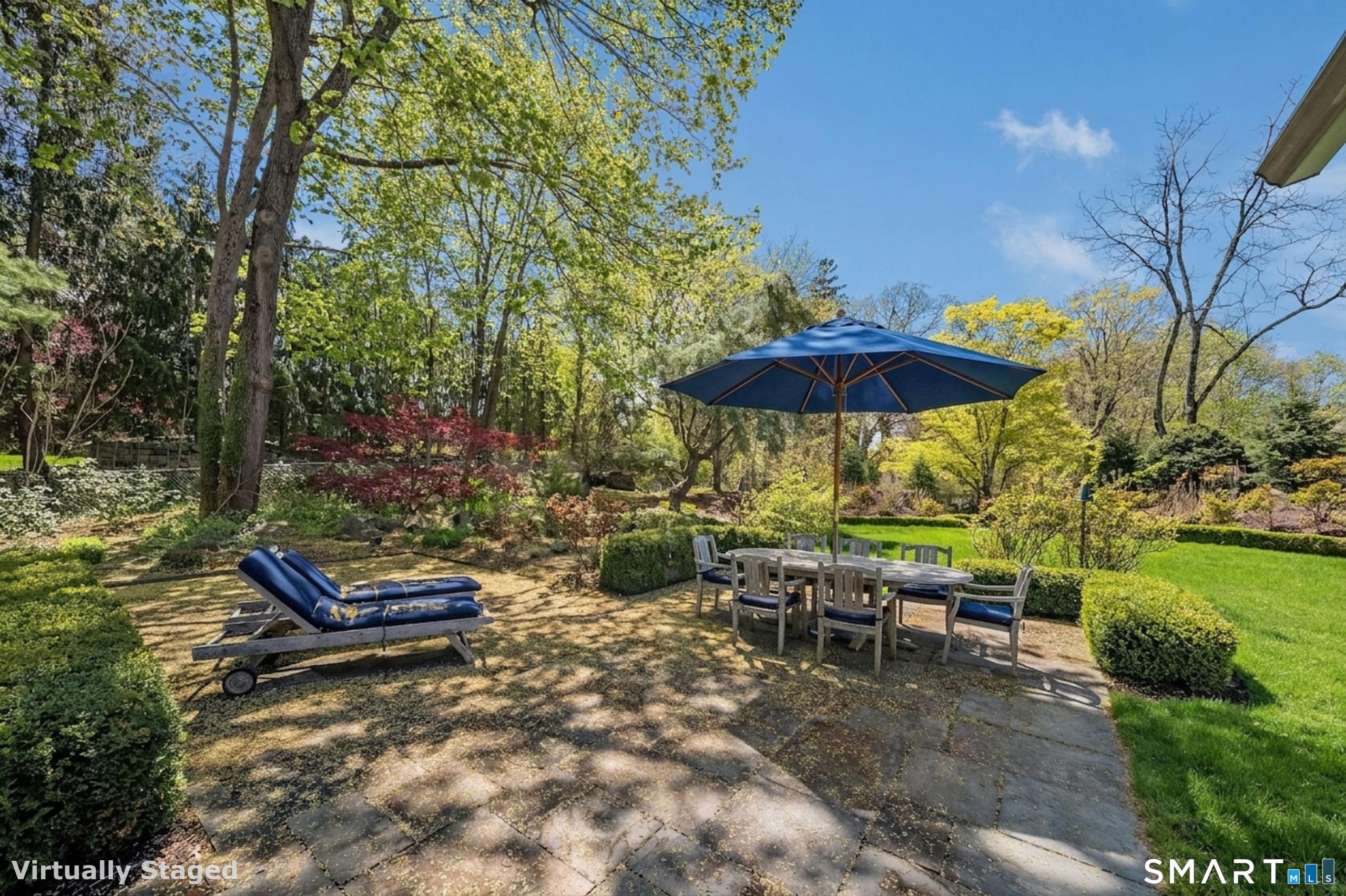 880 Boston Post Road Madison, CT 06443 - Photo 6 of 40 a backyard of a house with table and chairs