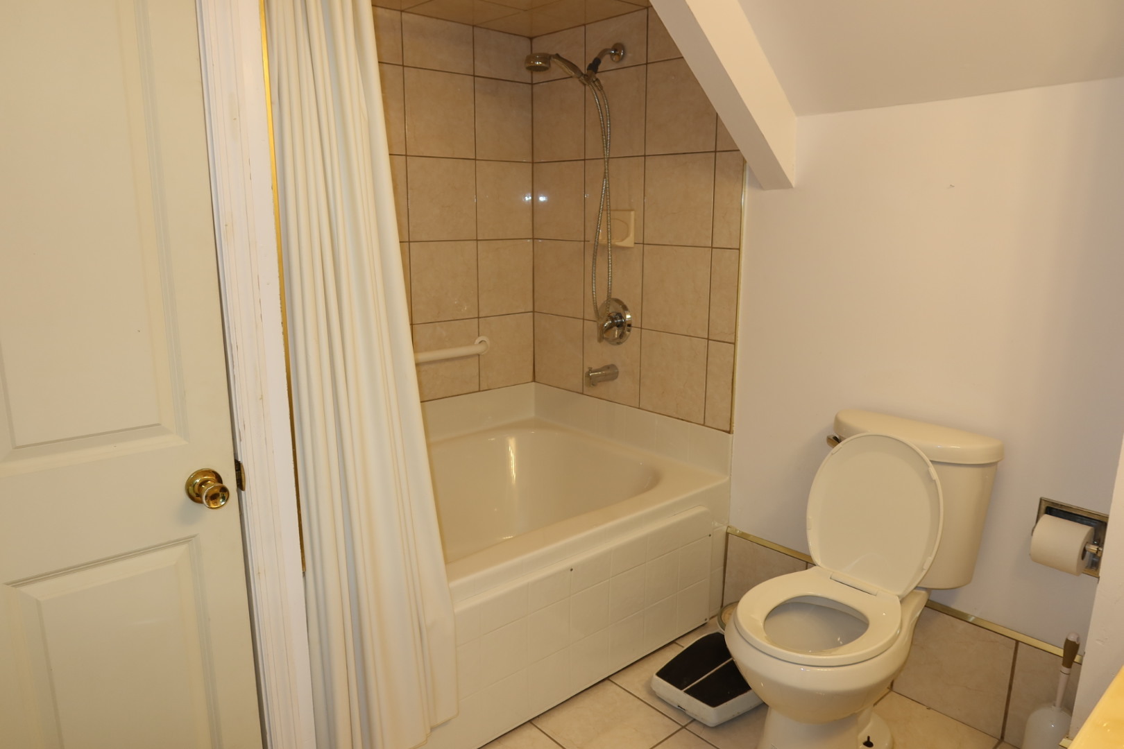 9766 South Prospect Avenue Chicago, IL 60643 - Photo 17 of 19 a white toilet sitting next to a bathtub