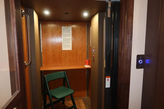 a bathroom with a mirror and a shower