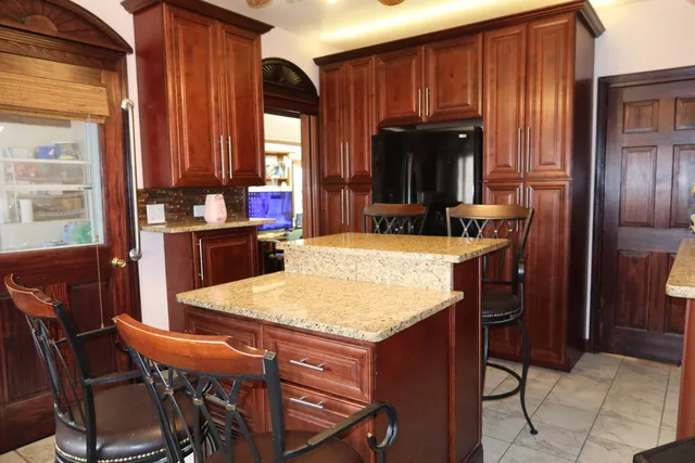 a dining table with chairs and window