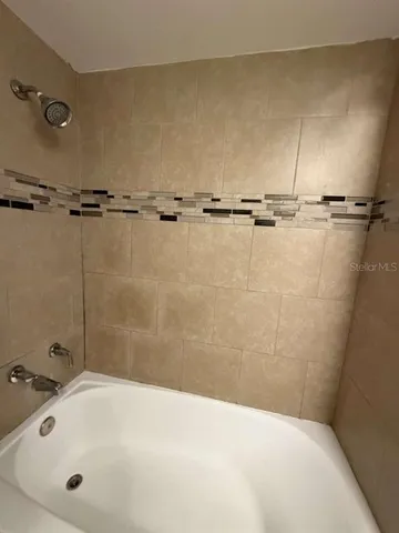 a bathroom with a white bath tub