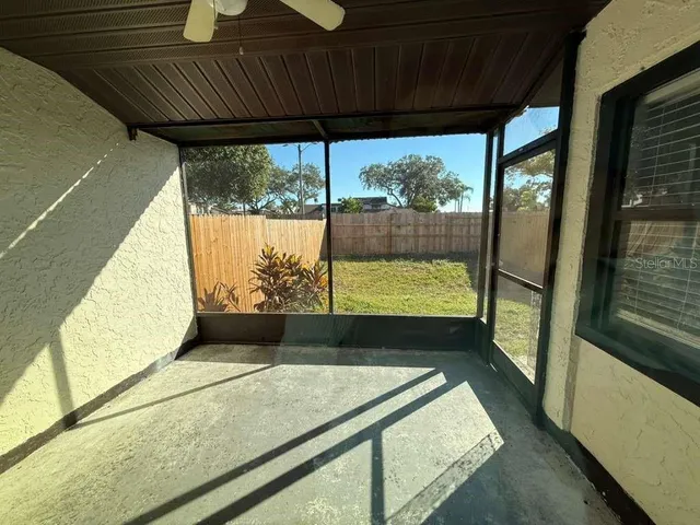 a view of a porch with wooden floor and outdoor space