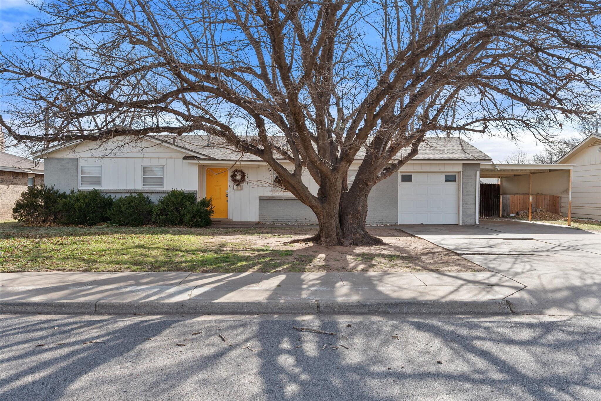 4803 8th Street Lubbock, TX 79416 - Photo 1 of 29 a front view of a house with garden
