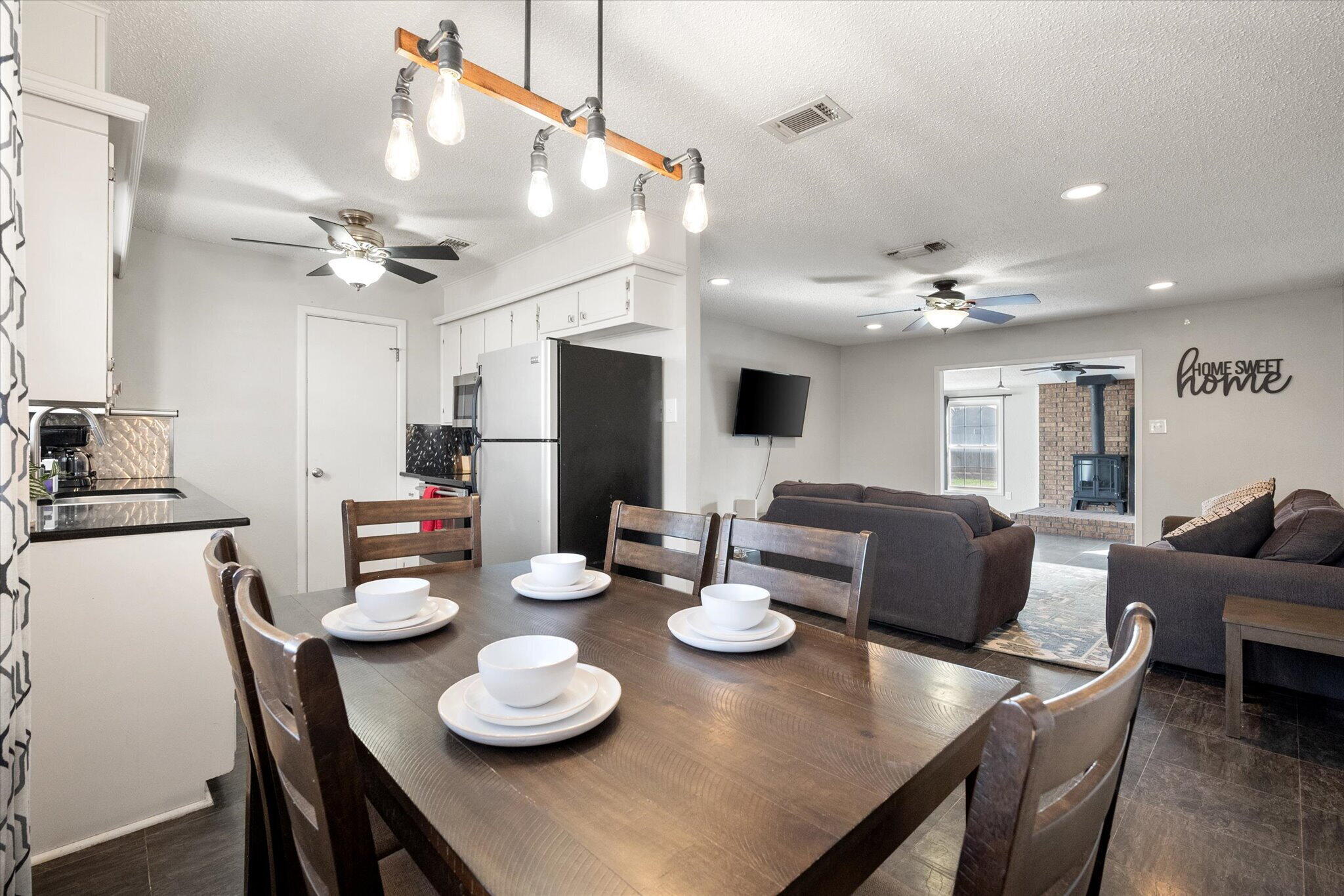 4803 8th Street Lubbock, TX 79416 - Photo 12 of 29 a kitchen with stainless steel appliances granite countertop a dining table and chairs