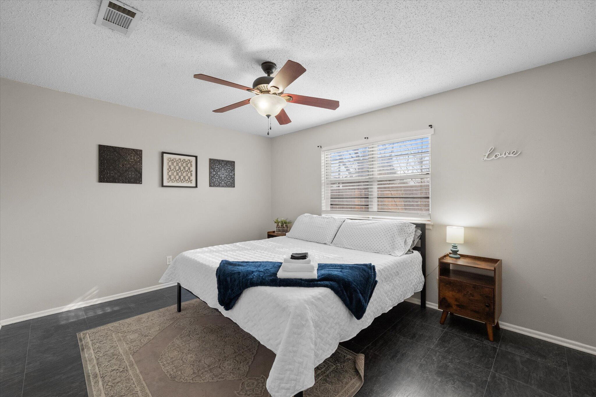 4803 8th Street Lubbock, TX 79416 - Photo 22 of 29 a bed room with a bed and a window