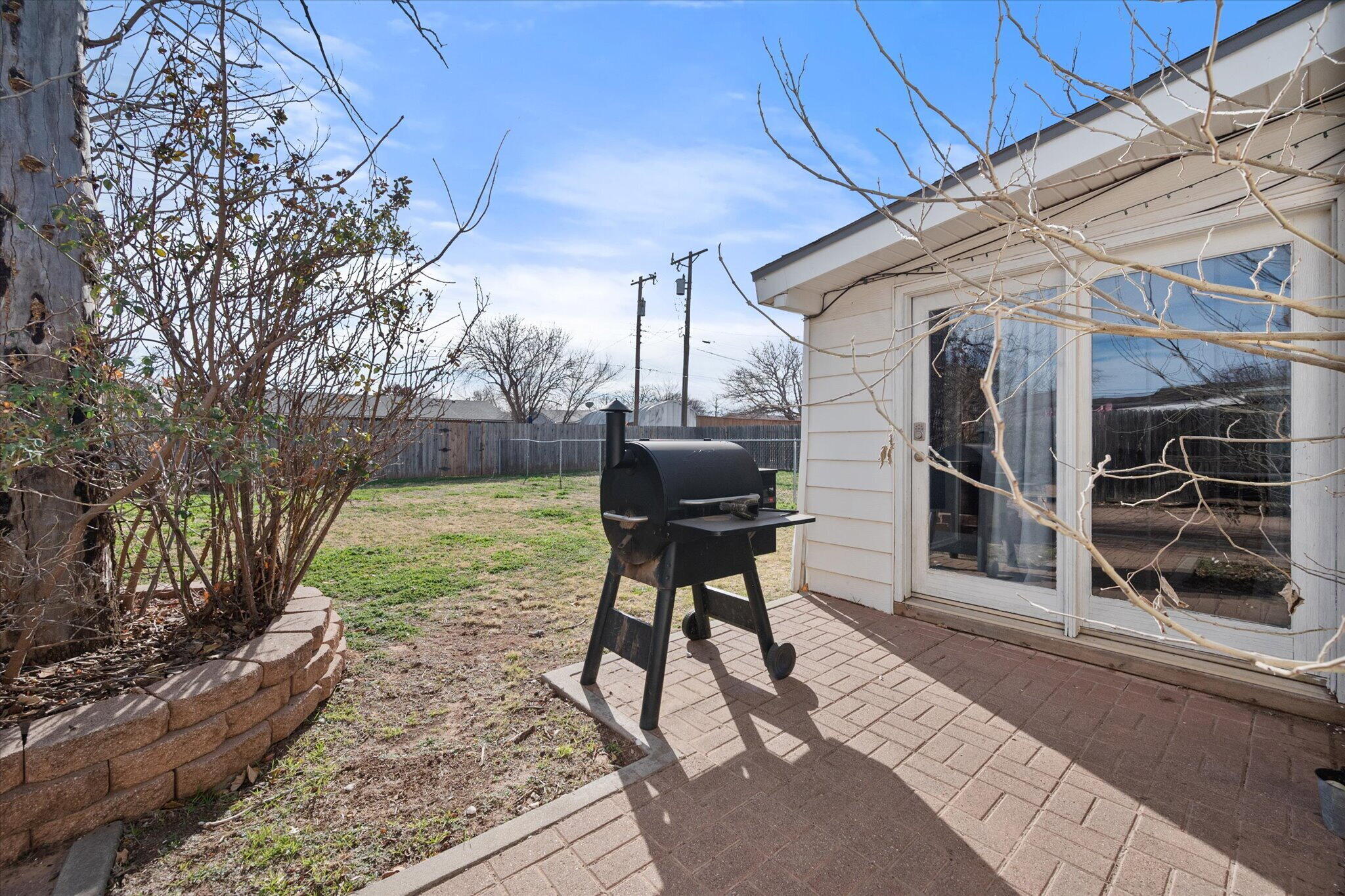 4803 8th Street Lubbock, TX 79416 - Photo 26 of 29 a backyard of a house with table and chairs