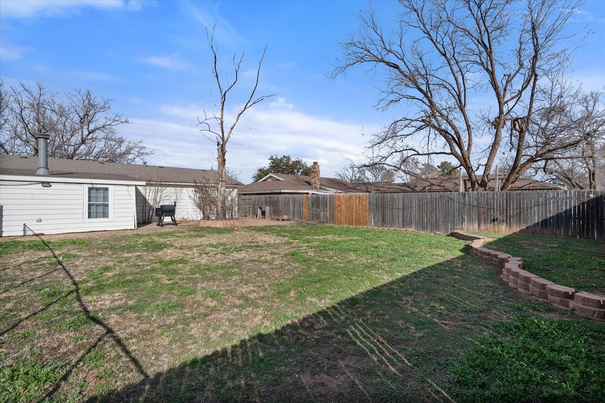 4803 8th Street Lubbock, TX 79416 - Photo 28 of 29 a front view of a house with garden