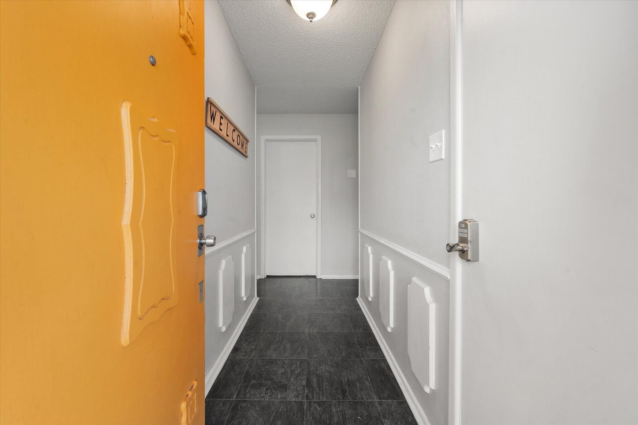 4803 8th Street Lubbock, TX 79416 - Photo 5 of 29 a view of a hallway with wooden floor