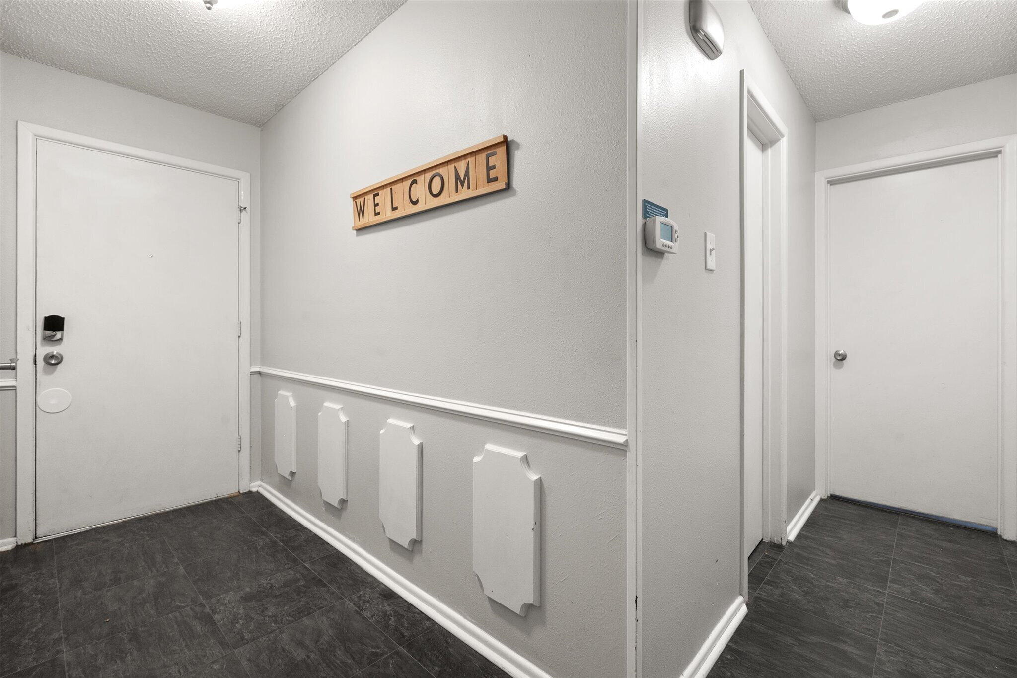 4803 8th Street Lubbock, TX 79416 - Photo 6 of 29 a view of a hallway with wooden floor