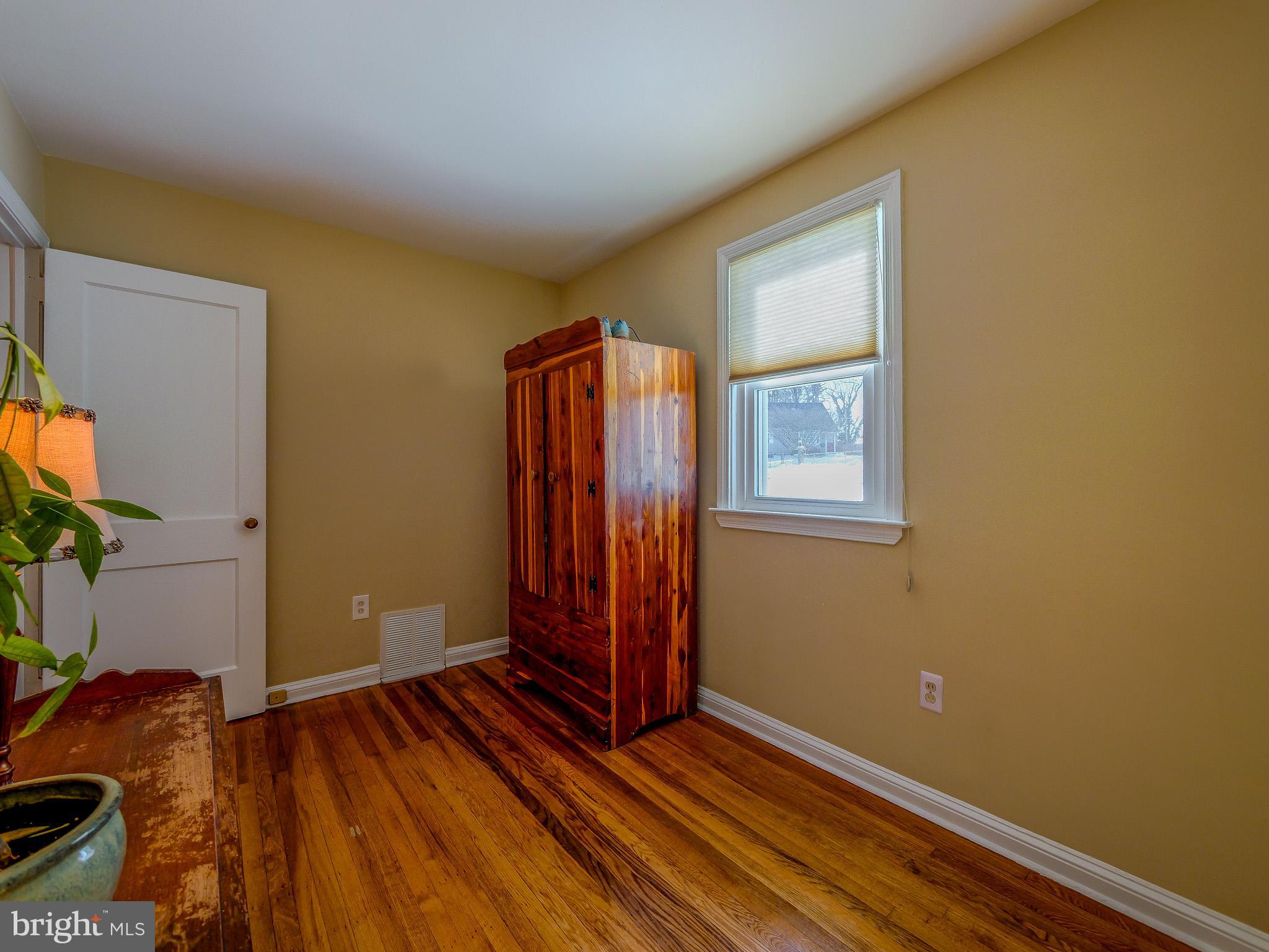118 North Line Road Newtown Square, PA 19073 - Photo 40 of 69 a view of an empty room with wooden floor and a window