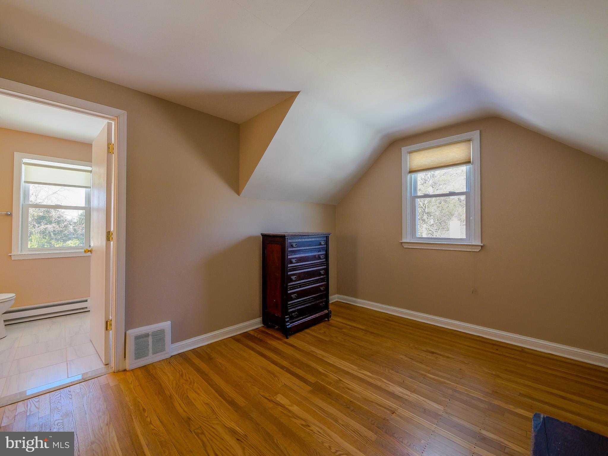 118 North Line Road Newtown Square, PA 19073 - Photo 46 of 69 a view of an empty room with a window and wooden floor