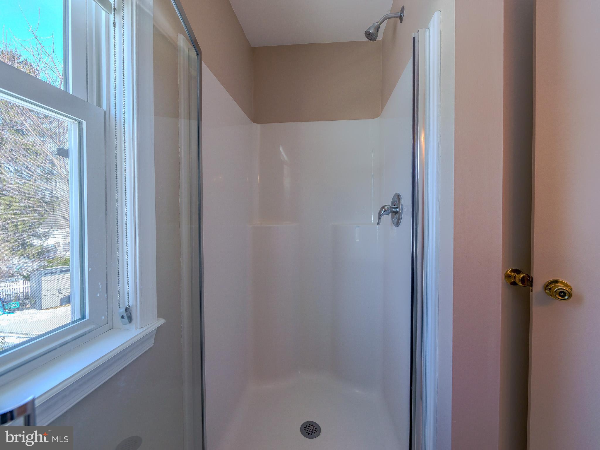 118 North Line Road Newtown Square, PA 19073 - Photo 52 of 69 a bathroom with a glass shower door