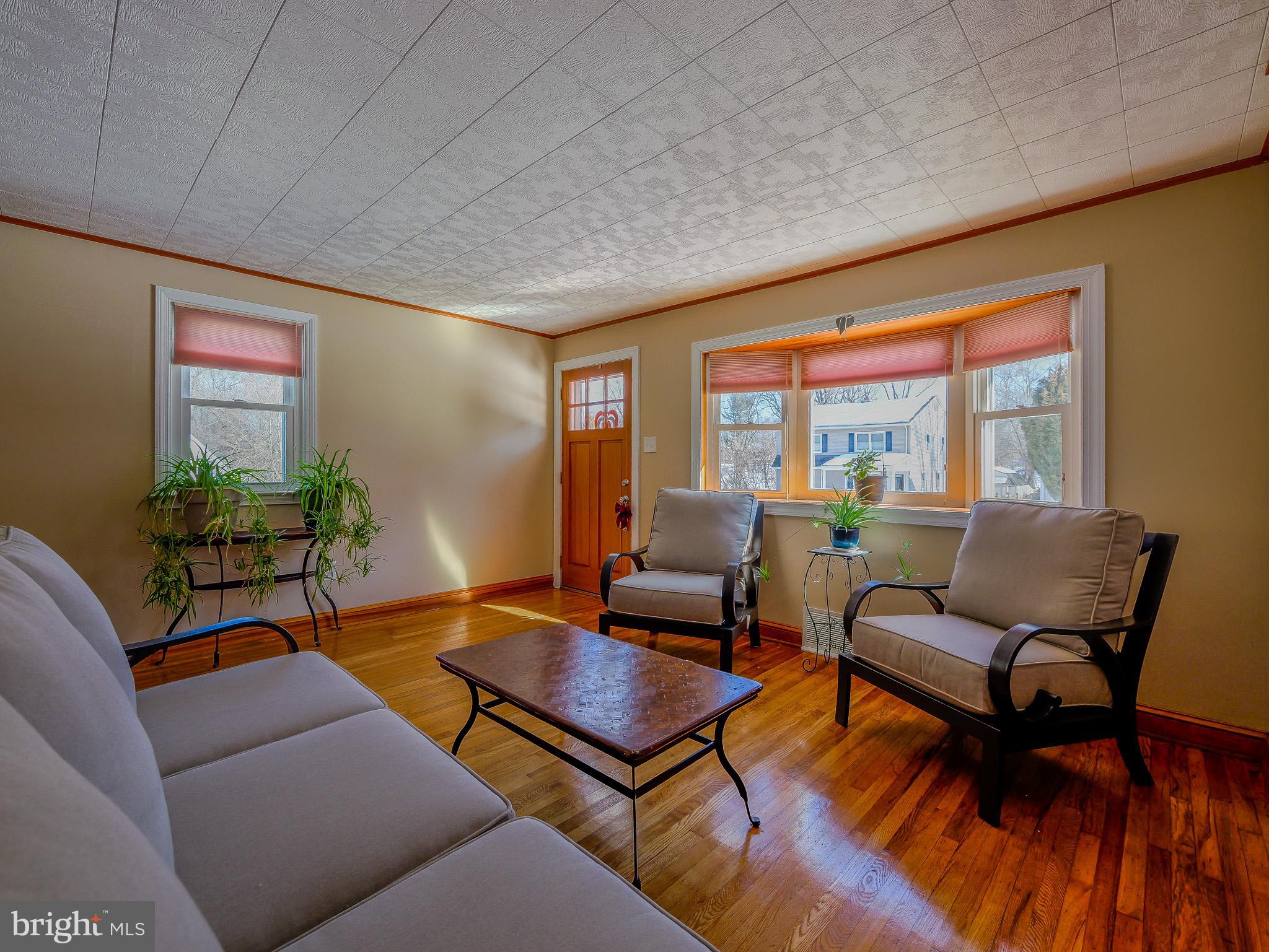 118 North Line Road Newtown Square, PA 19073 - Photo 9 of 69 a living room with furniture and a floor to ceiling window