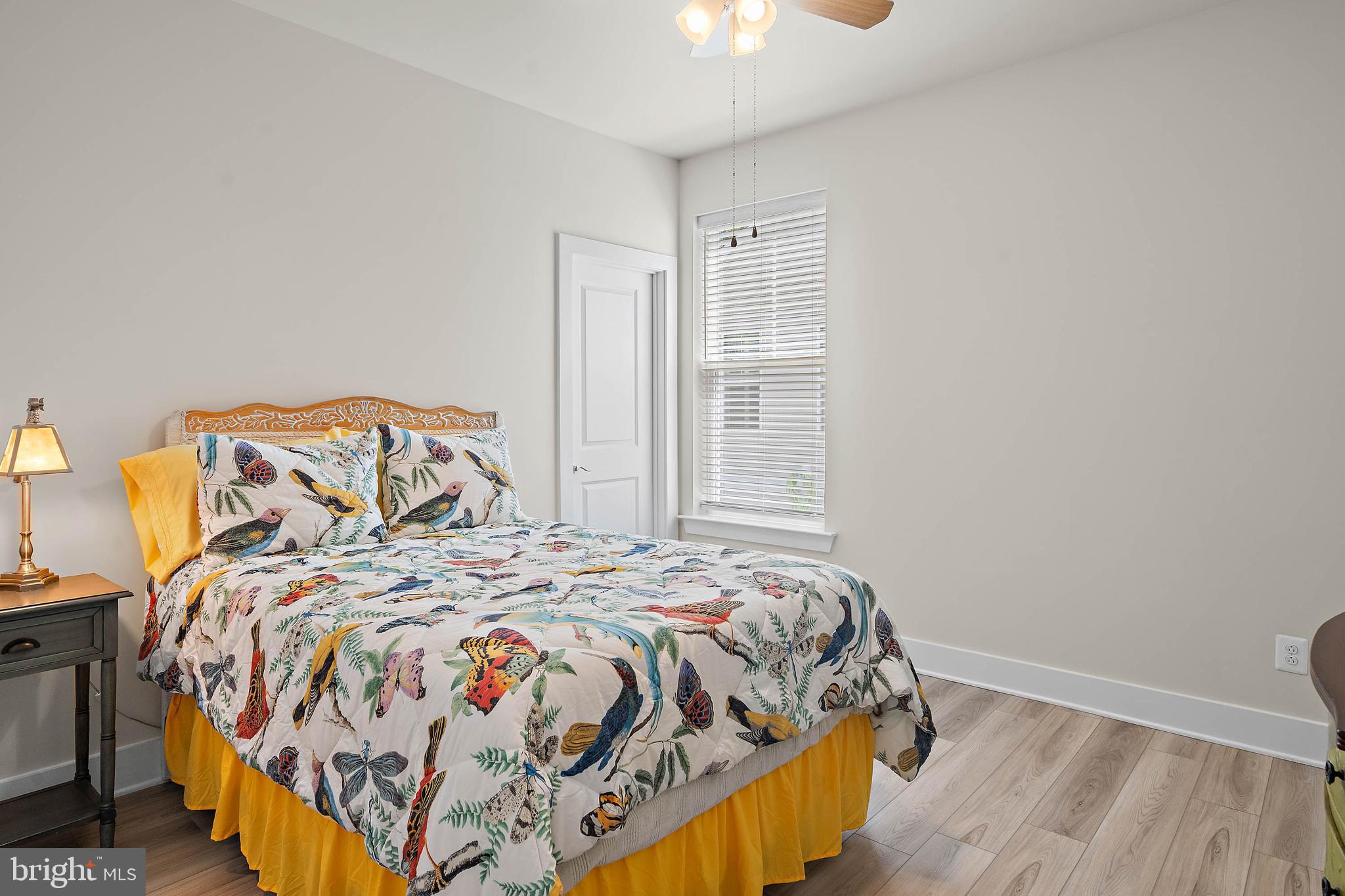 18565 Emerson Way Georgetown, DE 19947 - Photo 21 of 60 a bedroom with a bed and a window