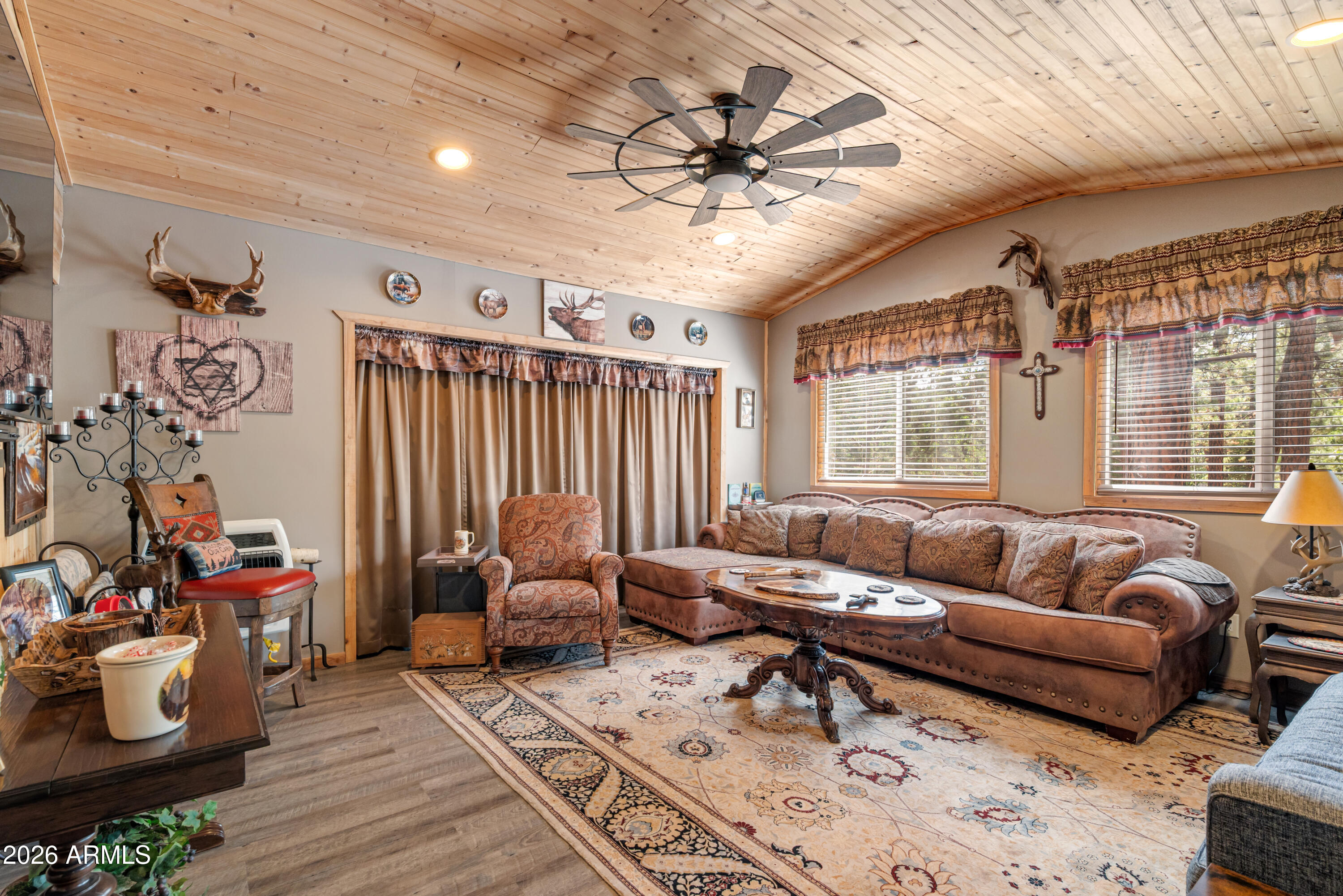 1659 Mormon Road Happy Jack, AZ 86024 - Photo 11 of 37 a living room with furniture and a large window