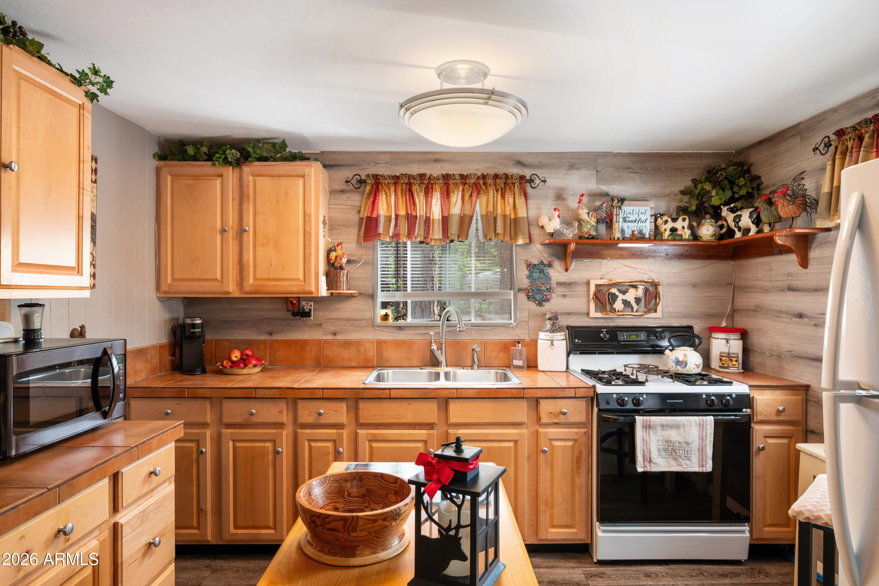 1659 Mormon Road Happy Jack, AZ 86024 - Photo 16 of 37 a kitchen with stainless steel appliances granite countertop a stove and a sink