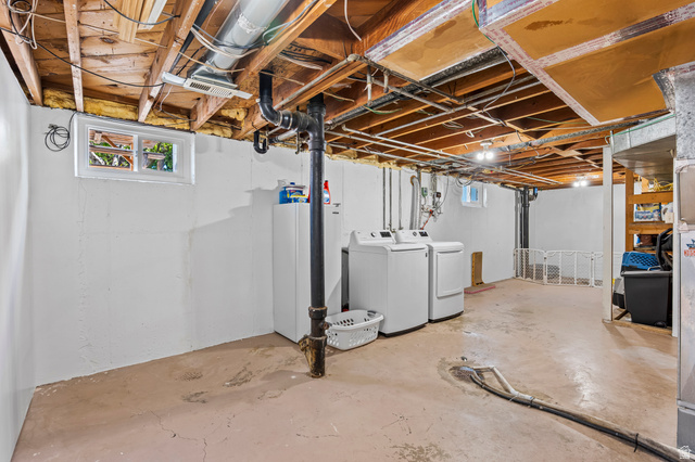480 North 150 E Street Springville, UT 84663 - Photo 26 of 36 Expansive lower level featuring exposed wood joists, concrete flooring, and a bright white wall finish