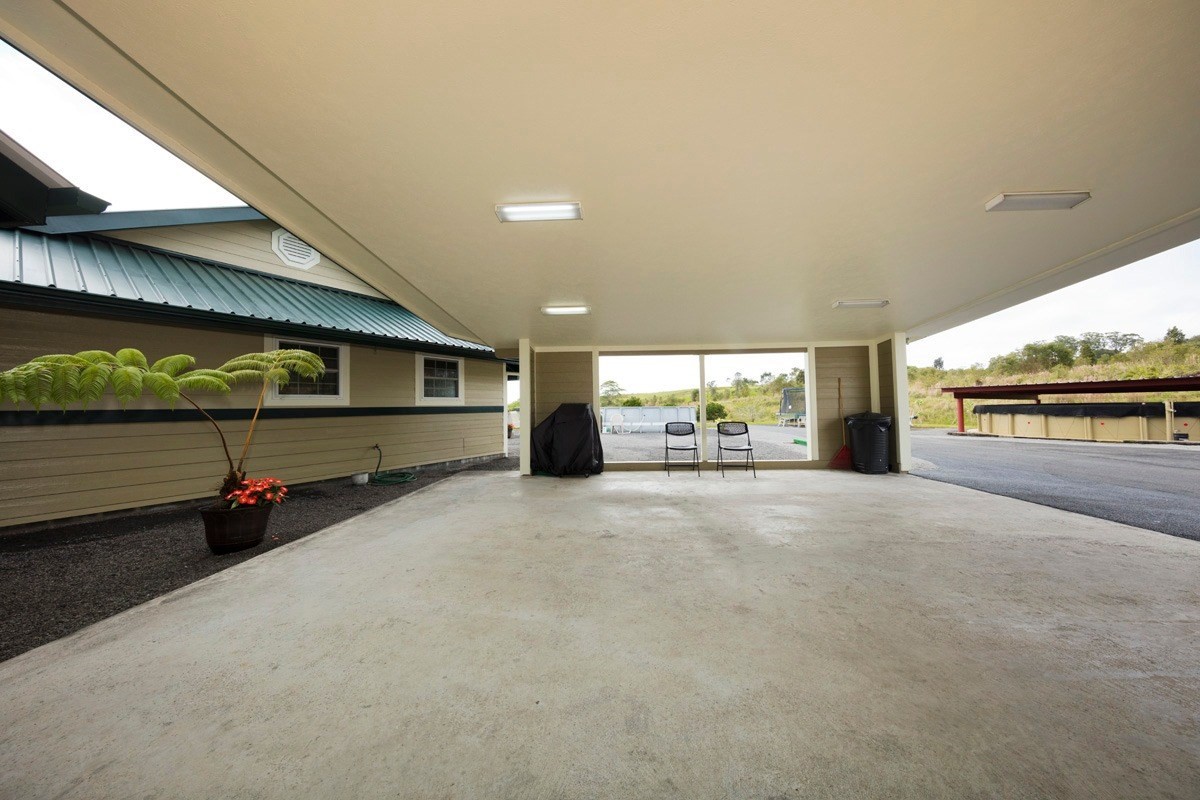 18-4235 North Pszyk Road Mountain View, HI 96771 - Photo 26 of 30 a view of garage with a car park in front of it