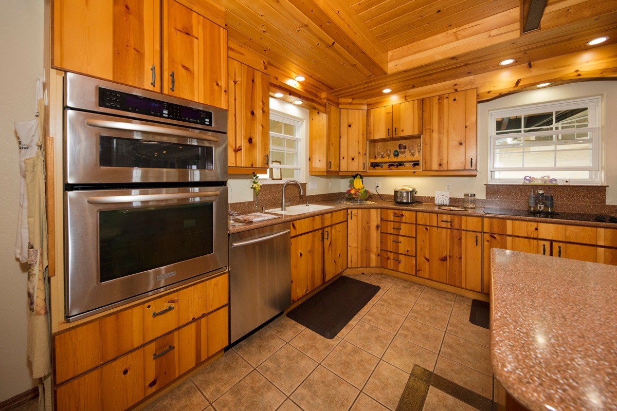 18-4235 North Pszyk Road Mountain View, HI 96771 - Photo 4 of 30 a kitchen with stainless steel appliances granite countertop a stove a sink and a microwave