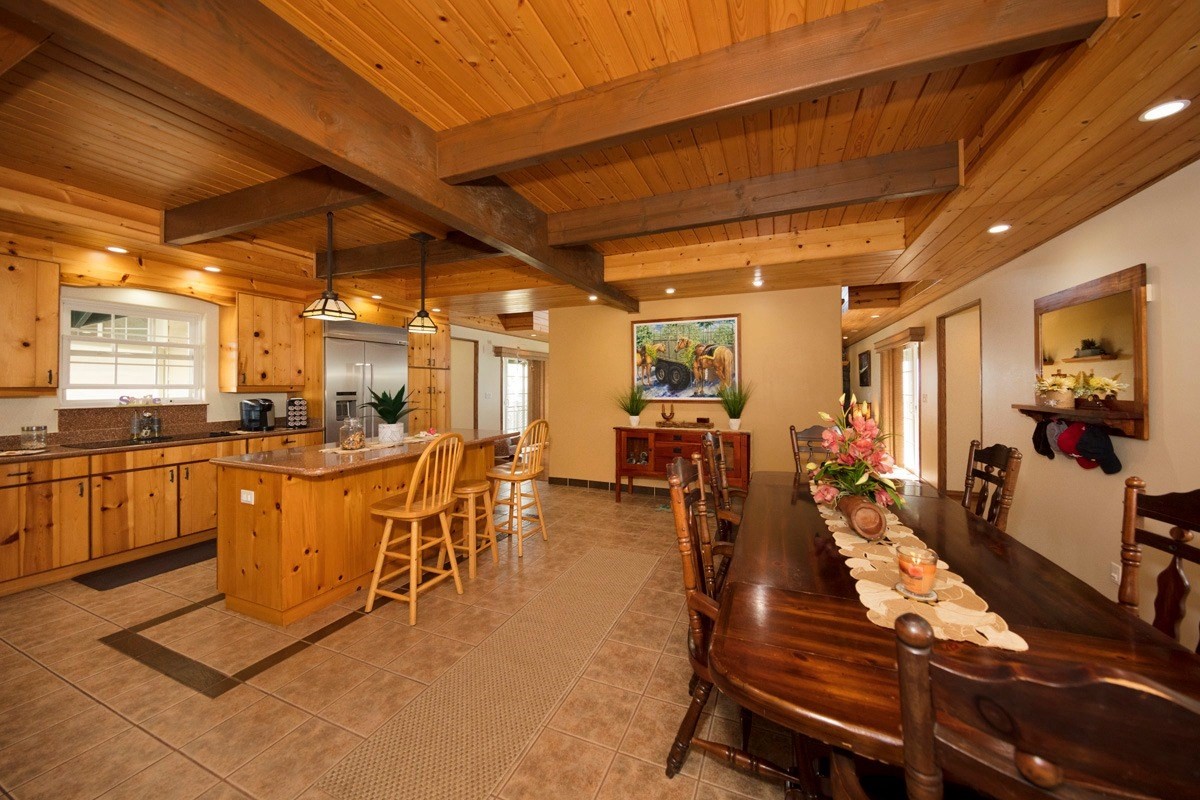 18-4235 North Pszyk Road Mountain View, HI 96771 - Photo 5 of 30 a view of a dining room with furniture window and wooden floor