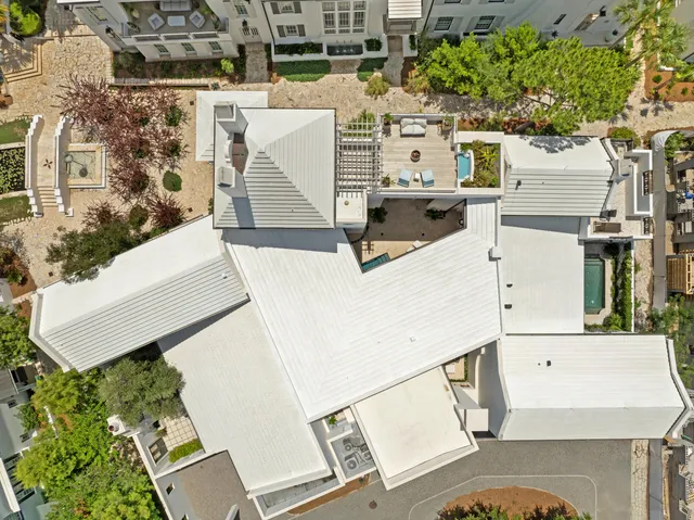 an aerial view of residential houses with outdoor space