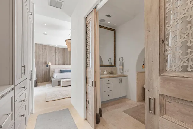 a bathroom with a sink a toilet and a window