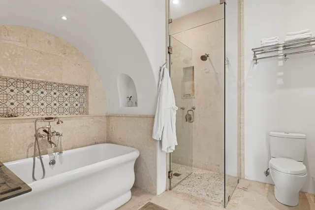 a bathroom with a bathtub and a window