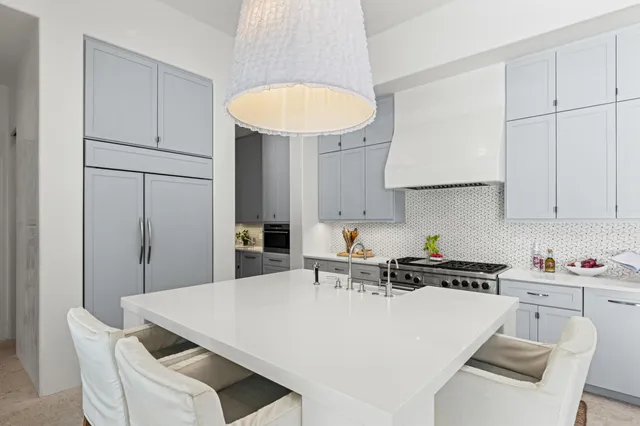 a spacious bedroom with a bed and a table