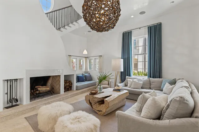 a bedroom with a large bed and a large window