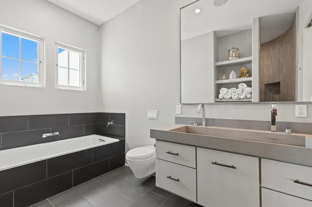 a view of street with retail shops