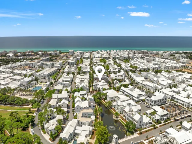 a bedroom with a bed and a potted plant