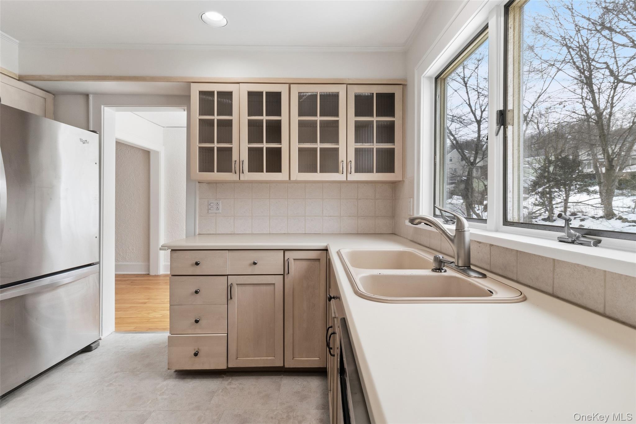 23 Garretson Road White Plains, NY 10604 - Photo 11 of 33 a kitchen with granite countertop a sink and a refrigerator