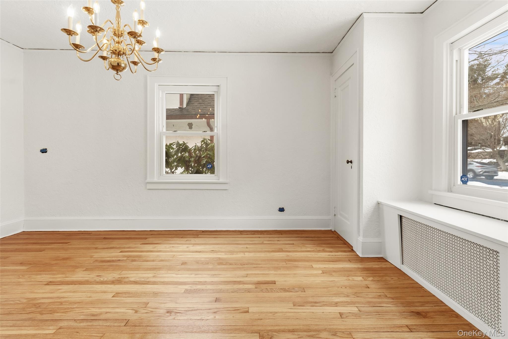 23 Garretson Road White Plains, NY 10604 - Photo 17 of 33 a view of an empty room with a window and a ceiling fan