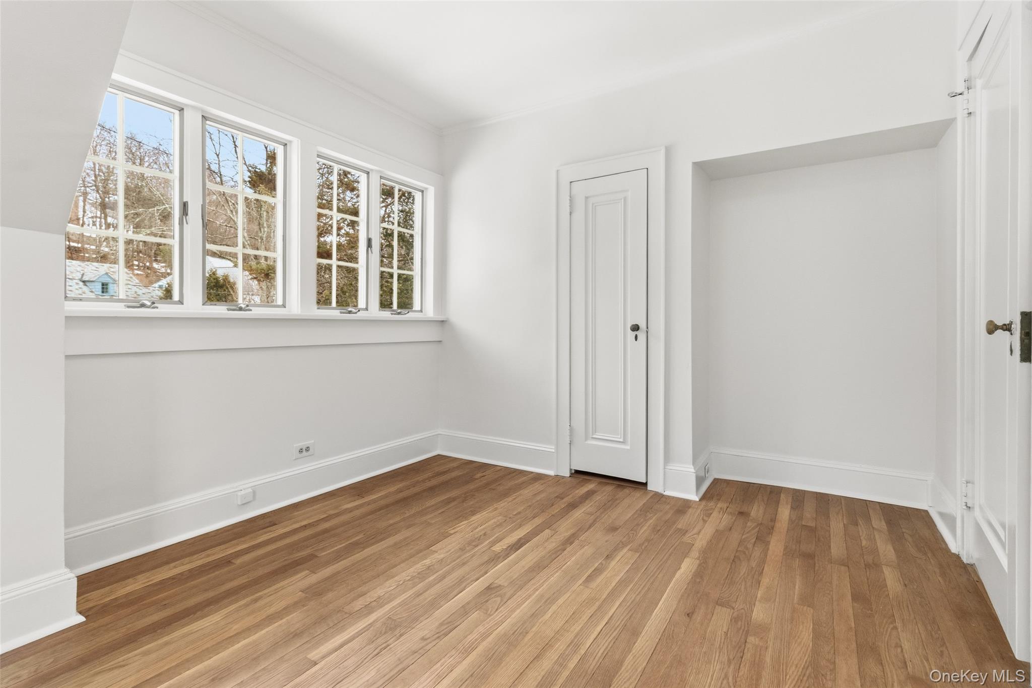 23 Garretson Road White Plains, NY 10604 - Photo 21 of 33 a view of empty room with wooden floor and fan