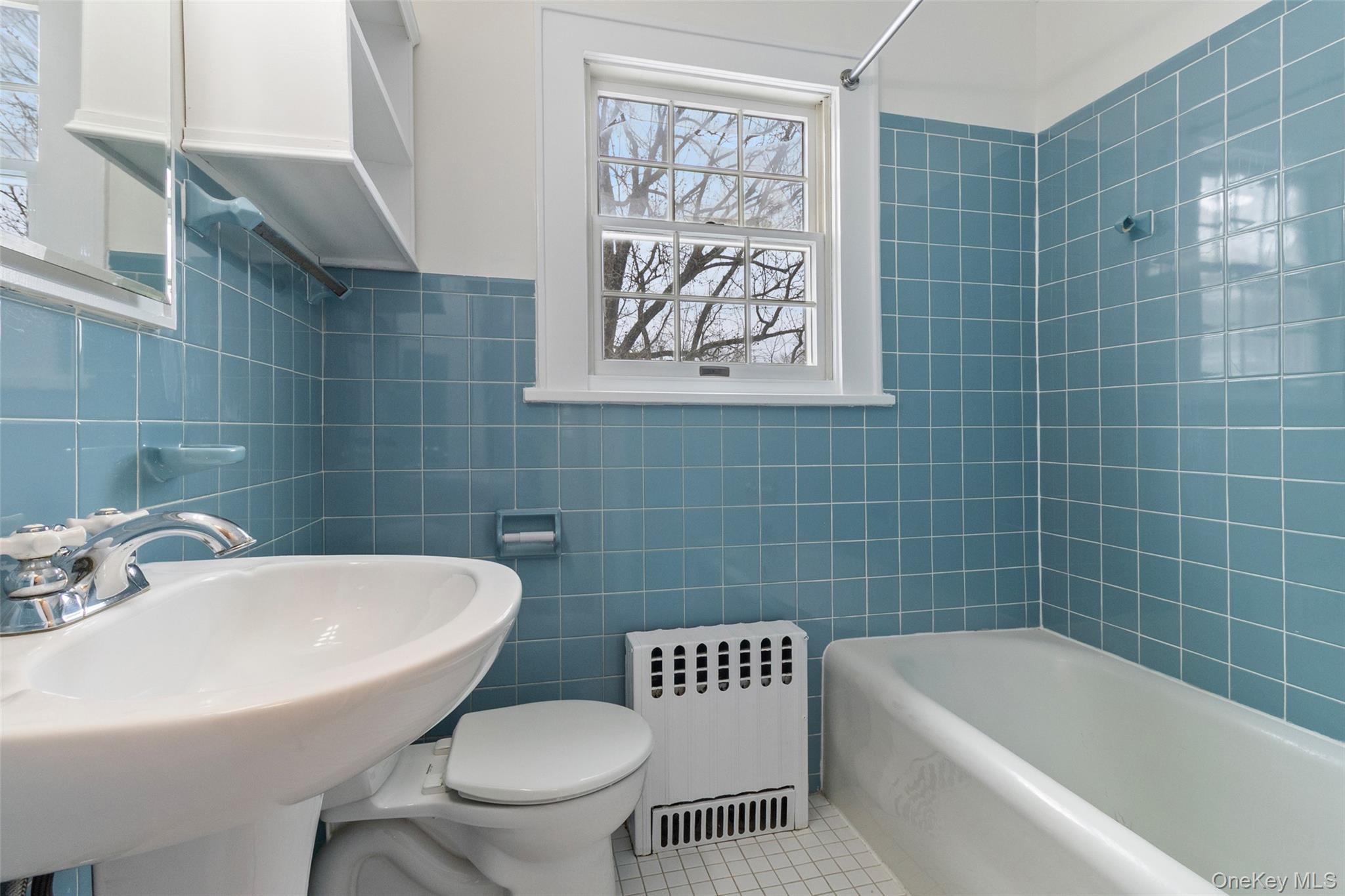 23 Garretson Road White Plains, NY 10604 - Photo 24 of 33 a bathroom with a toilet a sink and bathtub