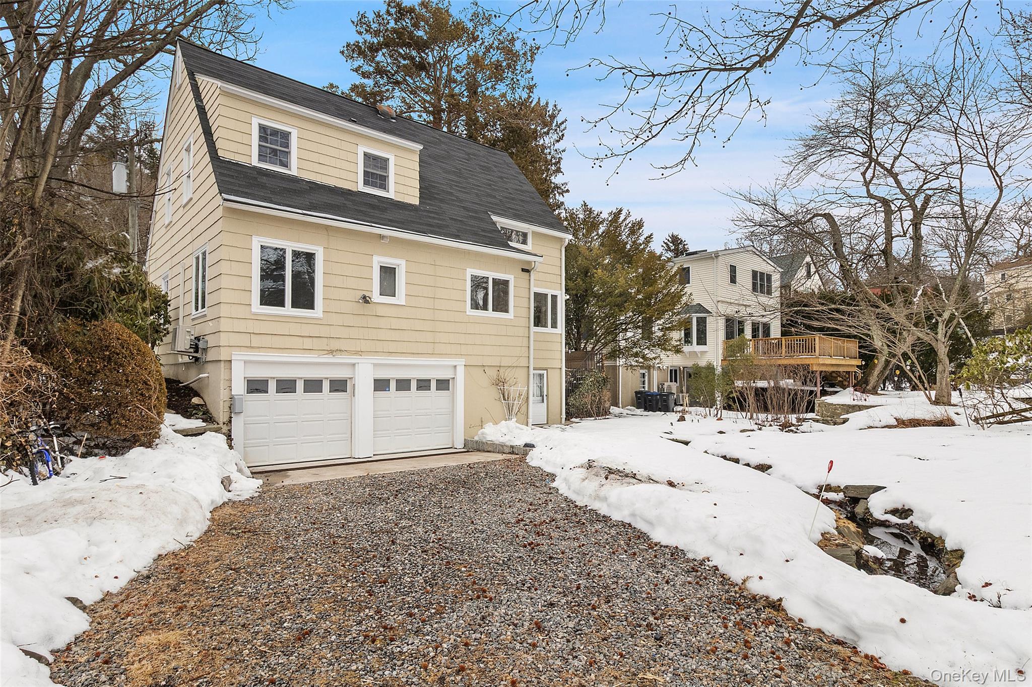 23 Garretson Road White Plains, NY 10604 - Photo 30 of 33 a front view of a house with a yard covered in snow