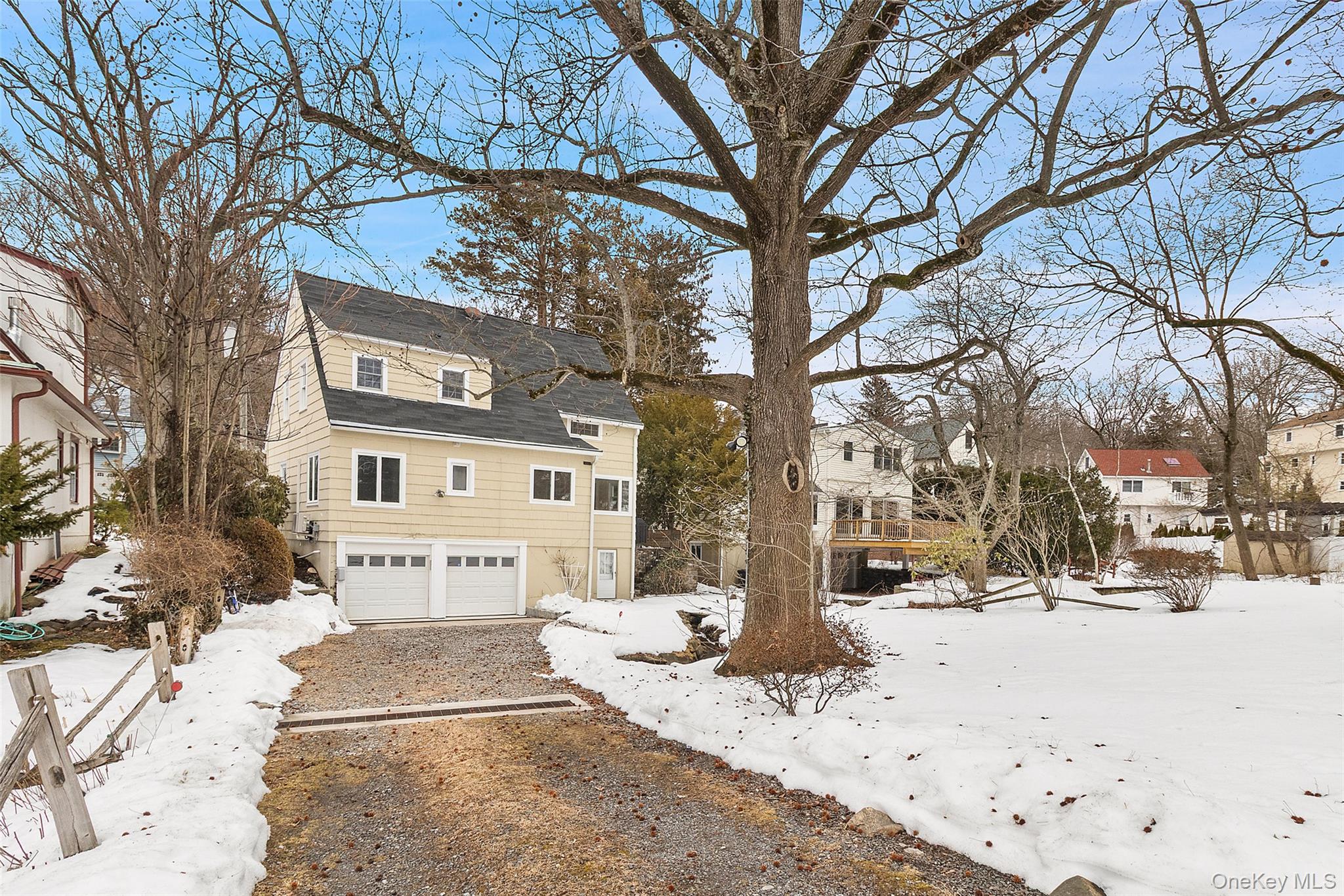 23 Garretson Road White Plains, NY 10604 - Photo 32 of 33 a street view with a street covered with snow