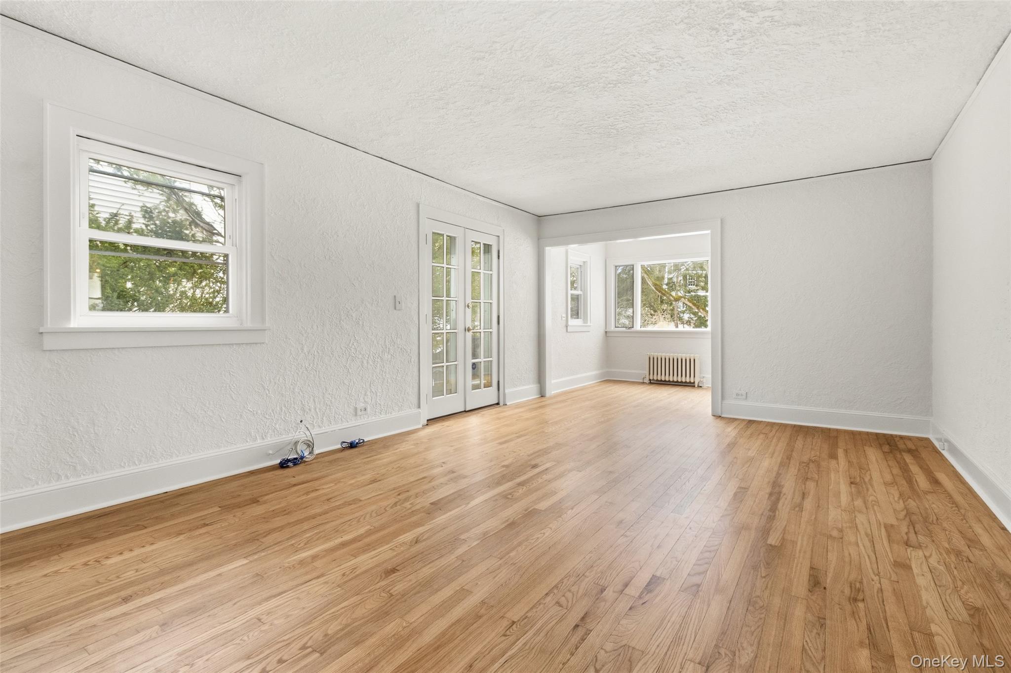 23 Garretson Road White Plains, NY 10604 - Photo 4 of 33 a view of an empty room with wooden floor and a window