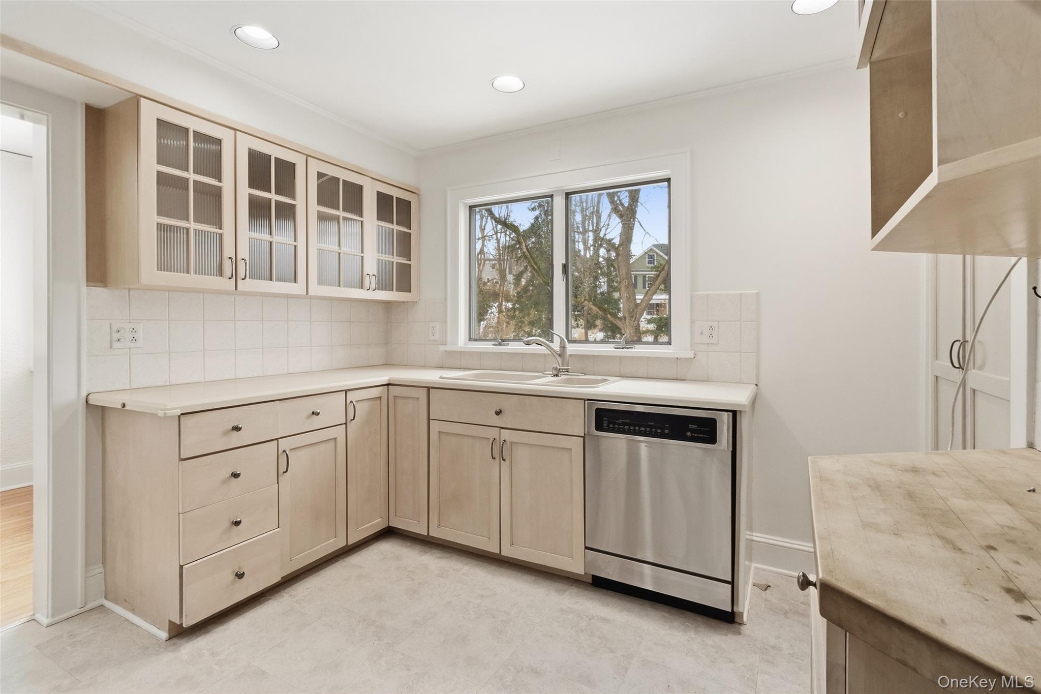 23 Garretson Road White Plains, NY 10604 - Photo 10 of 33 a kitchen with granite countertop white cabinets and a sink