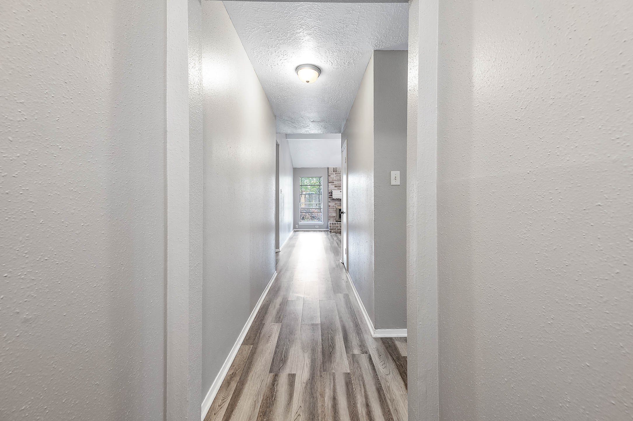 4918 Quailgate Drive Spring, TX 77373 - Photo 2 of 17 a view of a hallway with wooden floor